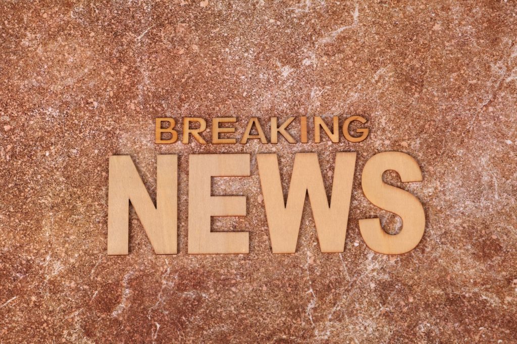 Wooden letters spell 'Breaking News' on a textured, marble-like background. Ideal for newsworthy content. — Sensible Medical